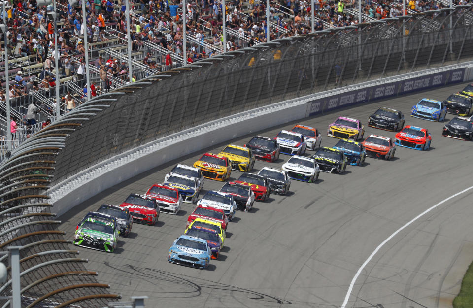 Cars restart after a yellow flag during a NASCAR Cup Series auto race at Michigan International Speedway in Brooklyn, Mich., Sunday, Aug. 12, 2018. (AP Photo/Paul Sancya)