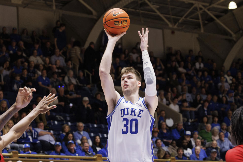 Duke's Kyle Filipowski (30) shoots against Louisville during the second half of an NCAA college basketball game in Durham, N.C., Wednesday, Feb. 28, 2024. (AP Photo/Ben McKeown)