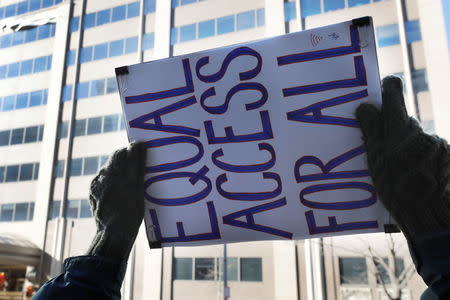 Net neutrality advocates rally in front of the Federal Communications Commission (FCC) ahead of Thursday's expected FCC vote repealing so-called net neutrality rules in Washington, U.S., December 13, 2017. REUTERS/Yuri Gripas