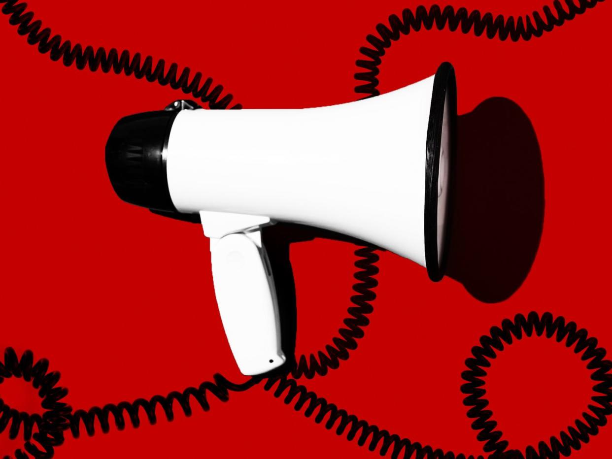 megaphone on red background with black coils