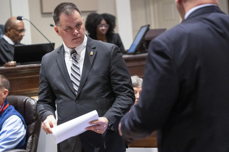 FBI special agent Matthew Wilde, front left, is questioned by prosecutor John Conrad during Alex Murdaugh’s double murder trial at the Colleton County Courthouse on Friday, Feb. 10, 2023, in Walterboro, S.C. Murdaugh is standing trial on two counts of murder in the shootings of his wife and son at their Colleton County home and hunting lodge on June 7, 2021. (Andrew J. Whitaker/The Post And Courier via AP, Pool)