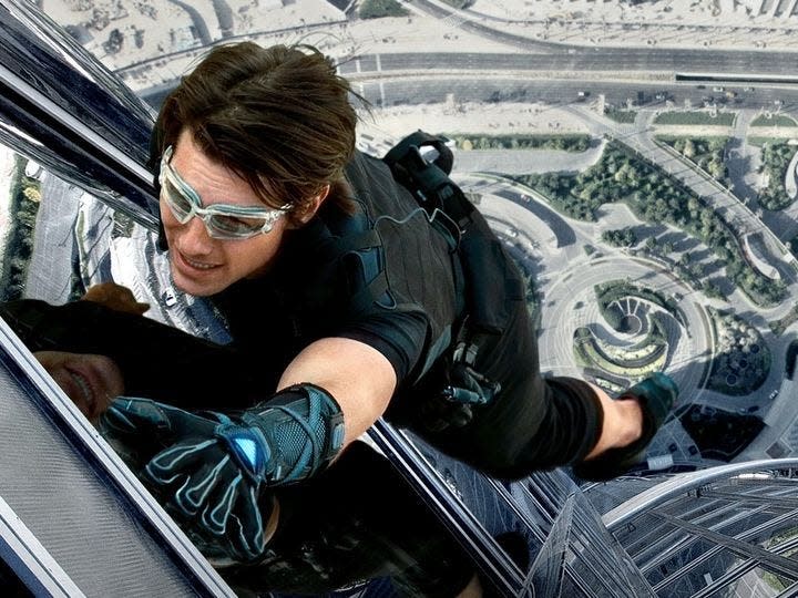 Tom Cruise in "Mission: Impossible - Ghost Protocol" scaling a building