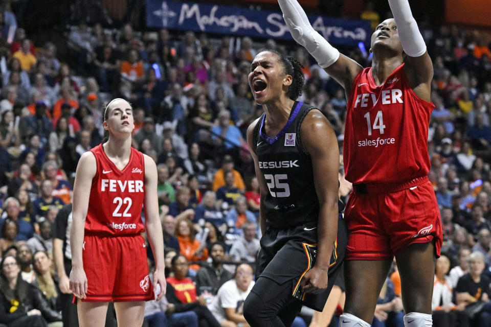 Connecticut Suns forward Alyssa Thomas (25) celebrates a basket while committing a foul during the second half of Game 2 of a first-round WNBA basketball playoff series against the Indiana Fever, Wednesday, Sept. 25, 2024, in Uncasville, Connecticut. (AP Photo/Jessica Hill)