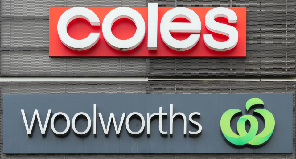 Building with supermarket signs from Coles and Woolworths