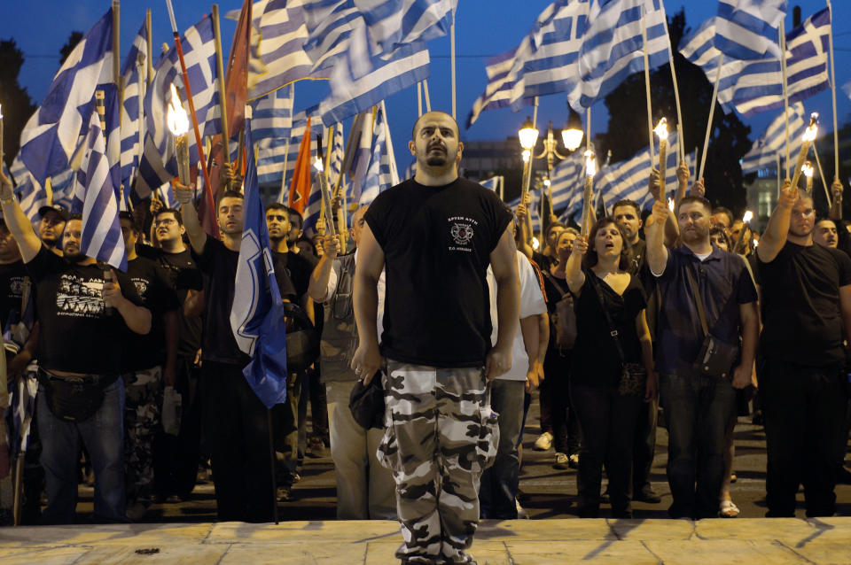 Members and supporters of the ultra-nationalist Golden Dawn party chant the national anthem in front of the Greek parliament in central Athens on May 29, 2013, during a rally marking the anniversary of the fall of Constantinople to the Ottoman Empire in 1453. (STR/AFP/Getty Images)