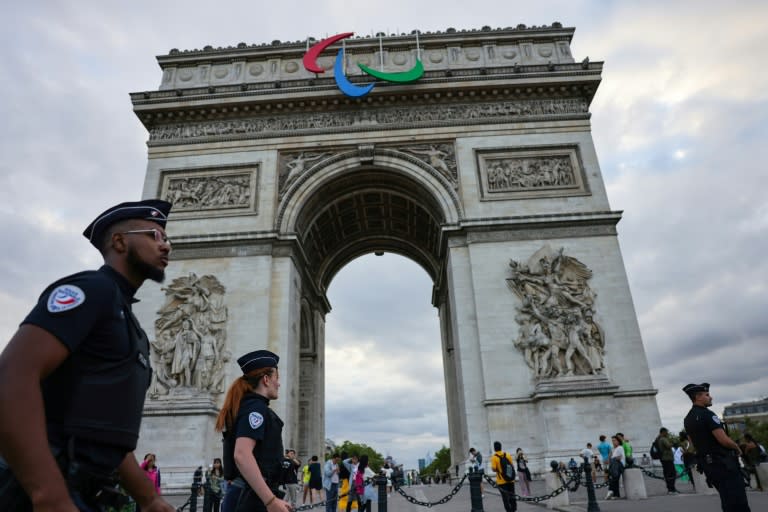 The symbol of the Paralympic Movement adorns the Arc de Triomphe (AHMAD GHARABLI)