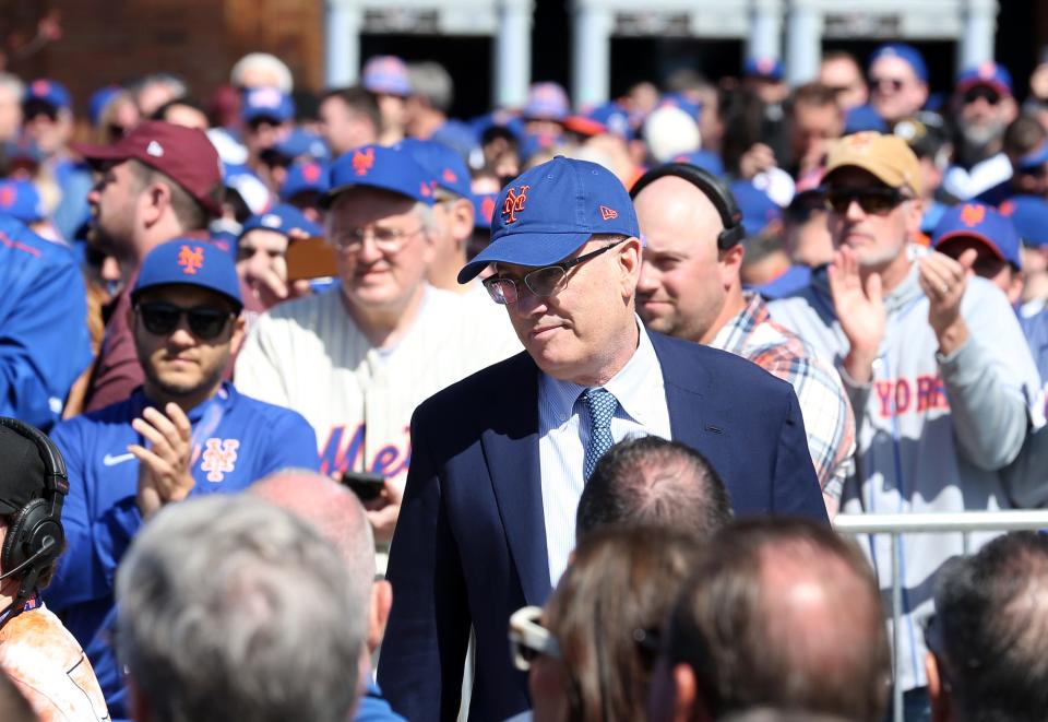 Fans cheer as Mets owner Steve Cohen walks through the crowd before the Tom Seaver statue is unveiled outside Citi Field before the start of a game between the Mets and the Diamondbacks on April 15, 2022 raised. 