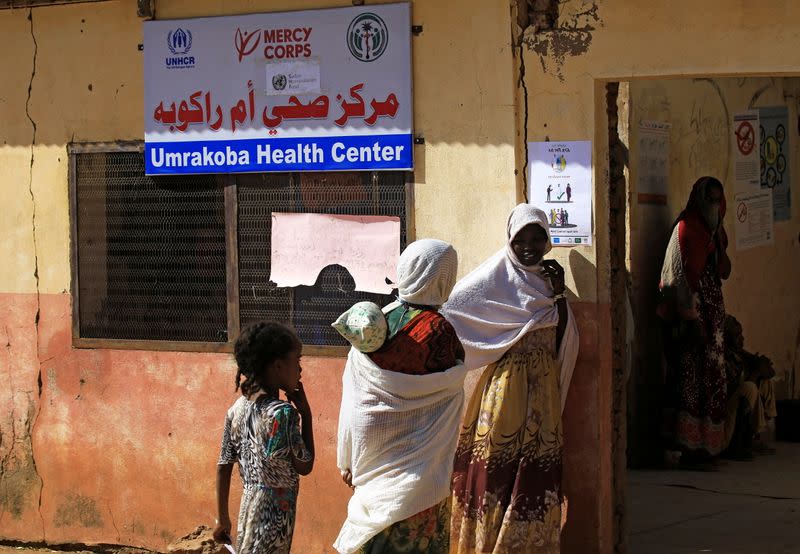 Ethiopians receive supplies at the Um-Rakoba camp on the Sudan-Ethiopia border