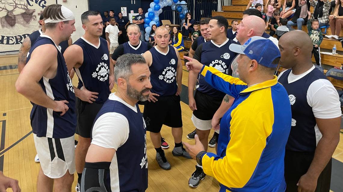 Elk Grove Police Department, or the Badges, huddle in the 4th quarter as they game heated up Saturday Oct. 14, 2023.