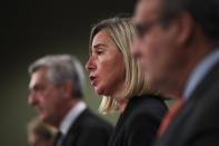 European Union Foreign Policy chief Federica Mogherini, center, talks to journalists during a joint news conference with UN High Commissioner for Refugees Filipo Grandi, left, and UN Migration Agency Director General Antonio Vitorino at the EU headquarters in Brussels, Tuesday, Oct. 29, 2019. The European Union says a "solidarity conference" has raised around 120 million euros ($133 million) for Venezuelans fleeing their crisis-wracked country and to help countries who are hosting them. (AP Photo/Francisco Seco)