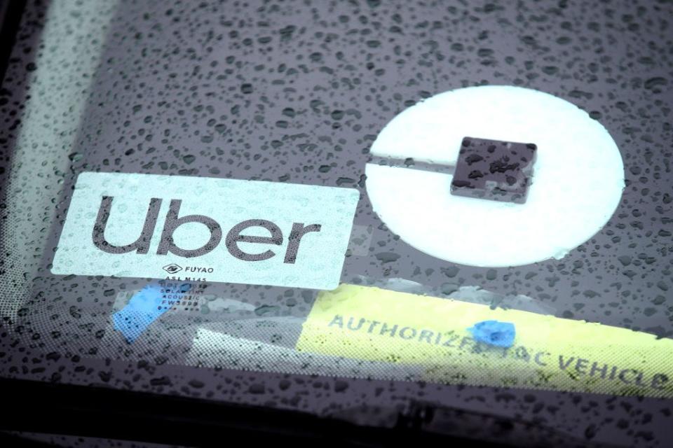 The Uber logo is displayed on a car on March 22, 2019, in San Francisco, Calif.