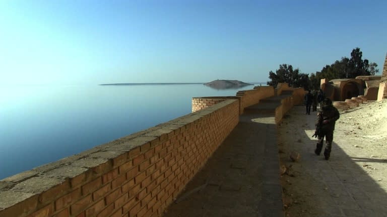 Fighters patrol a citadel on the edge of Lake Assad, behind the Tabqa dam west of Raqa, northern Syria, in a screengrab captured on March 5, 2017 from an AFPTV video filmed on February 26, 2017