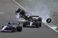 Alfa Romeo driver Guanyu Zhou of China crashes at the start of the British Formula One Grand Prix at the Silverstone circuit, in Silverstone, England, Sunday, July 3, 2022. (AP Photo/Frank Augstein)