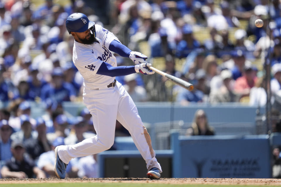 Los Angeles Dodgers' Teoscar Hernández hits a home run during the sixth inning of a baseball game against the Atlanta Braves in Los Angeles, Sunday, May 5, 2024. (AP Photo/Ashley Landis)