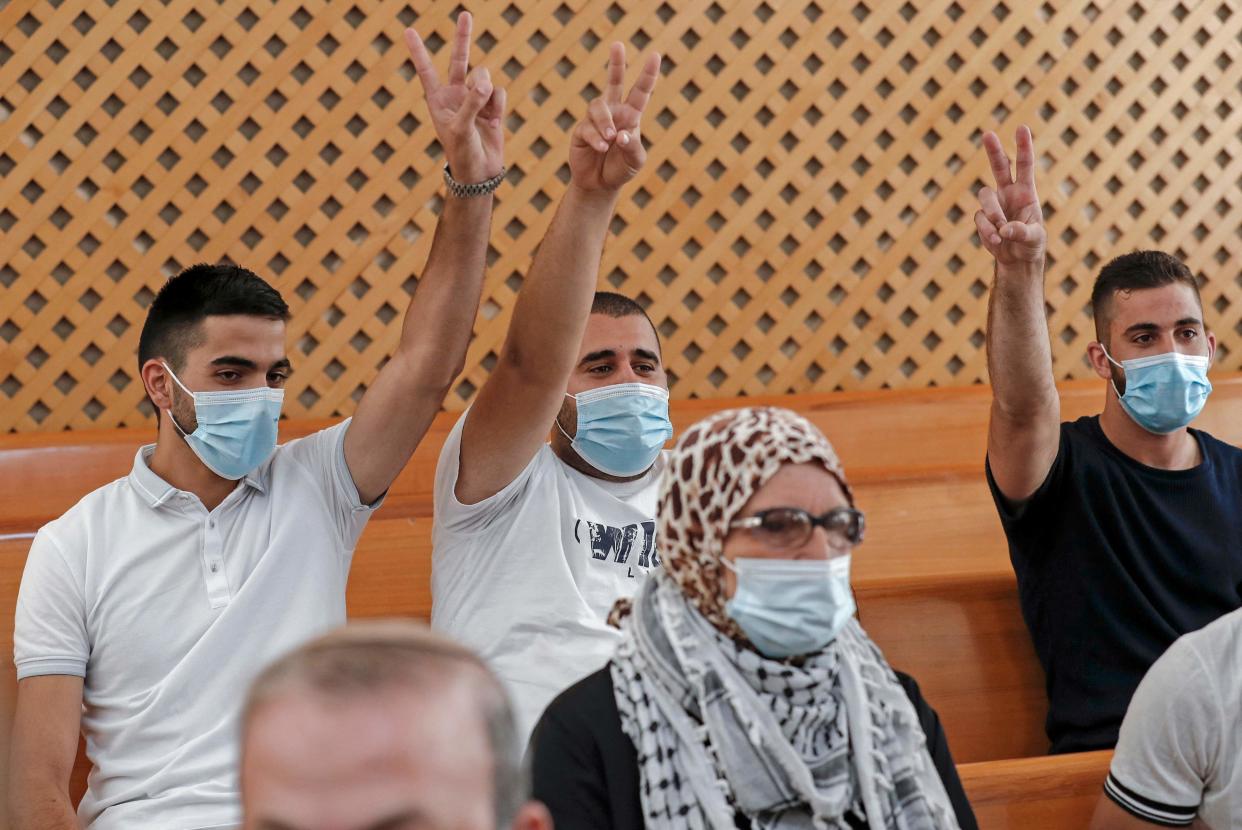 Palestinian residents of the Sheikh Jarrah neighbourhood attend a hearing at Israel's supreme court in Jerusalem on August 2 (AFP via Getty Images)