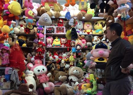 A vendor stands at a soft toy stall at a wholesale market in Dandong, China's border town with North Korea, November 23, 2016. REUTERS/Sue-Lin Wong