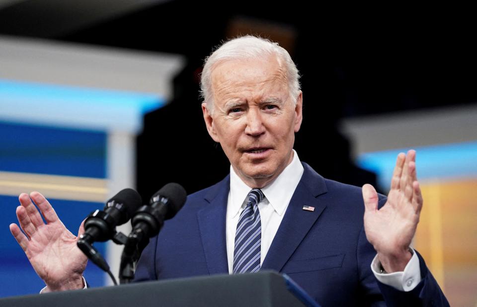 President Joe Biden speaking at podium