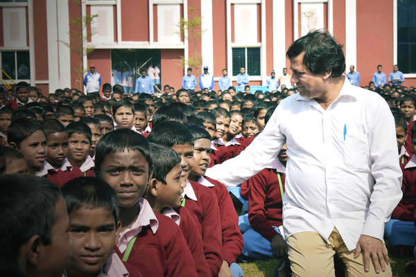 Dr Achyuta Samanta, founder of KIIT and KISS sharing a light moment with students of KISS