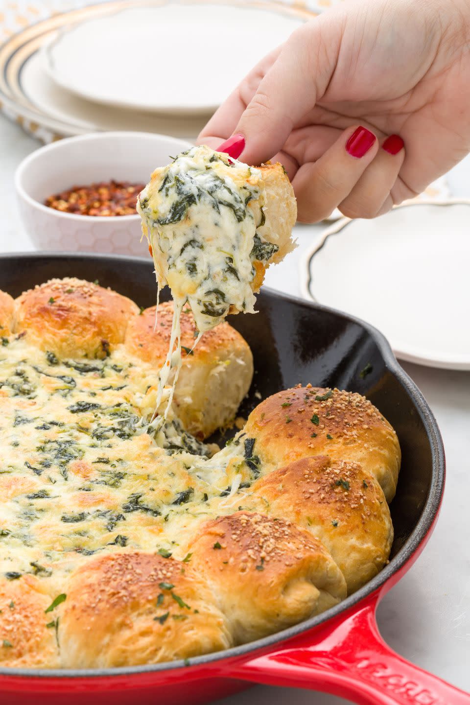 <p>Biscuits baked around a cheesy, spinach-y dip. Good times!</p><p>Get the recipe from <a href="https://www.redbookmag.com/cooking/recipe-ideas/recipes/a45181/baked-biscuit-wreath-dip-recipe/" rel="nofollow noopener" target="_blank" data-ylk="slk:Delish;elm:context_link;itc:0;sec:content-canvas" class="link ">Delish</a>.</p>