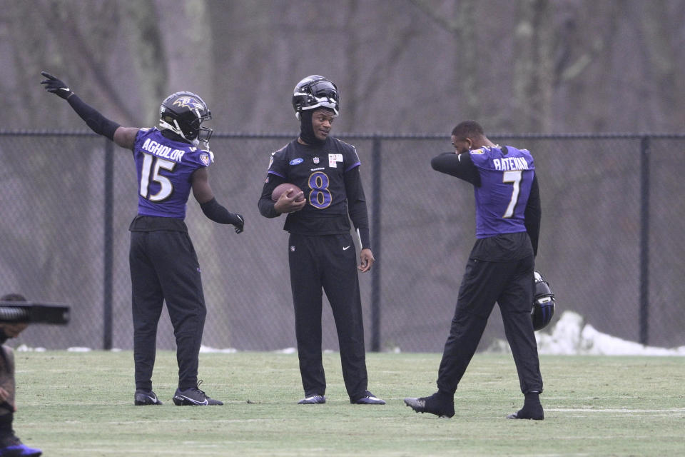 Baltimore Ravens quarterback Lamar Jackson (8) talks with wide receiver Nelson Agholor (15) and wide receiver Rashod Bateman (7) during an NFL football practice, Thursday, Jan. 25, 2024, in Owings Mills, Md. The Ravens face the Kansas City Chiefs in the AFC Championship on Sunday. (AP Photo/Nick Wass)