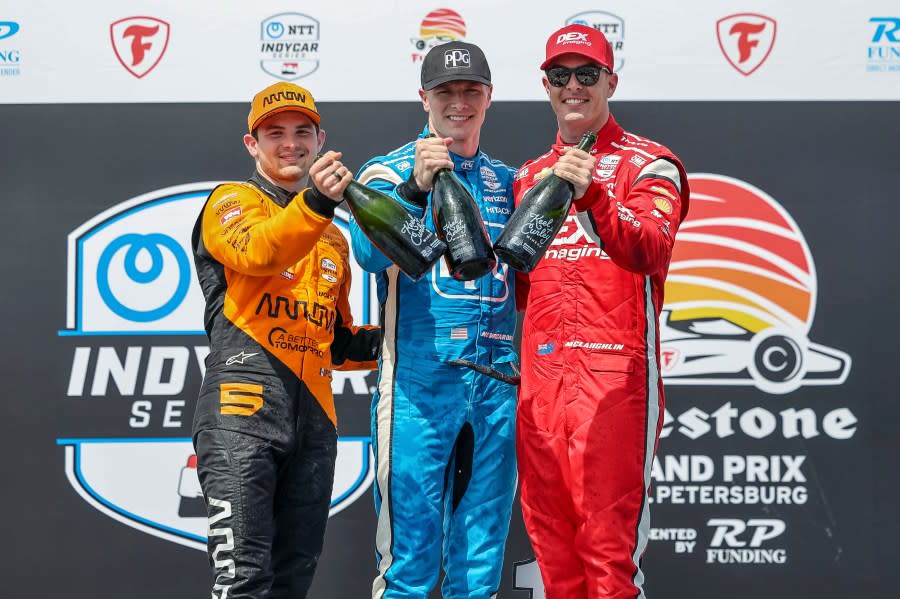 FILE – Team Penske driver Josef Newgarden, center, celebrates his first place finish along with second place finisher Arrow McLaren driver Pato O’Ward of <a class="link " href="https://sports.yahoo.com/soccer/teams/mexico/" data-i13n="sec:content-canvas;subsec:anchor_text;elm:context_link" data-ylk="slk:Mexico;sec:content-canvas;subsec:anchor_text;elm:context_link;itc:0">Mexico</a>, left, and third place finisher Team Penske driver Scott McLaughlin of <a class="link " href="https://sports.yahoo.com/soccer/teams/new-zealand/" data-i13n="sec:content-canvas;subsec:anchor_text;elm:context_link" data-ylk="slk:New Zealand;sec:content-canvas;subsec:anchor_text;elm:context_link;itc:0">New Zealand</a> in the IndyCar Grand Prix of St. Petersburg auto race, Sunday, March 10, 2024, in St. Petersburg, Fla. Team Penske suffered a humiliating disqualification Wednesday, April 24, when reigning Indianapolis 500 winner Josef Newgarden was stripped of his victory in the season-opening race for manipulating his push-to-pass system. Penske teammate Scott McLaughlin, who finished third in the opener on the downtown streets of St. Petersburg, Florida, was also disqualified. (AP Photo/Mike Carlson)