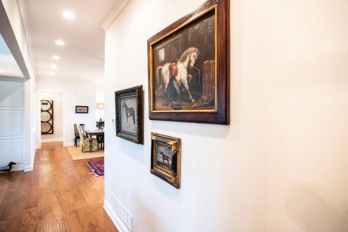 Equestrian artwork on a great room wall in Kim Smith&#39;s home in a North Oldham neighborhood of Kentucky. April 21, 2022