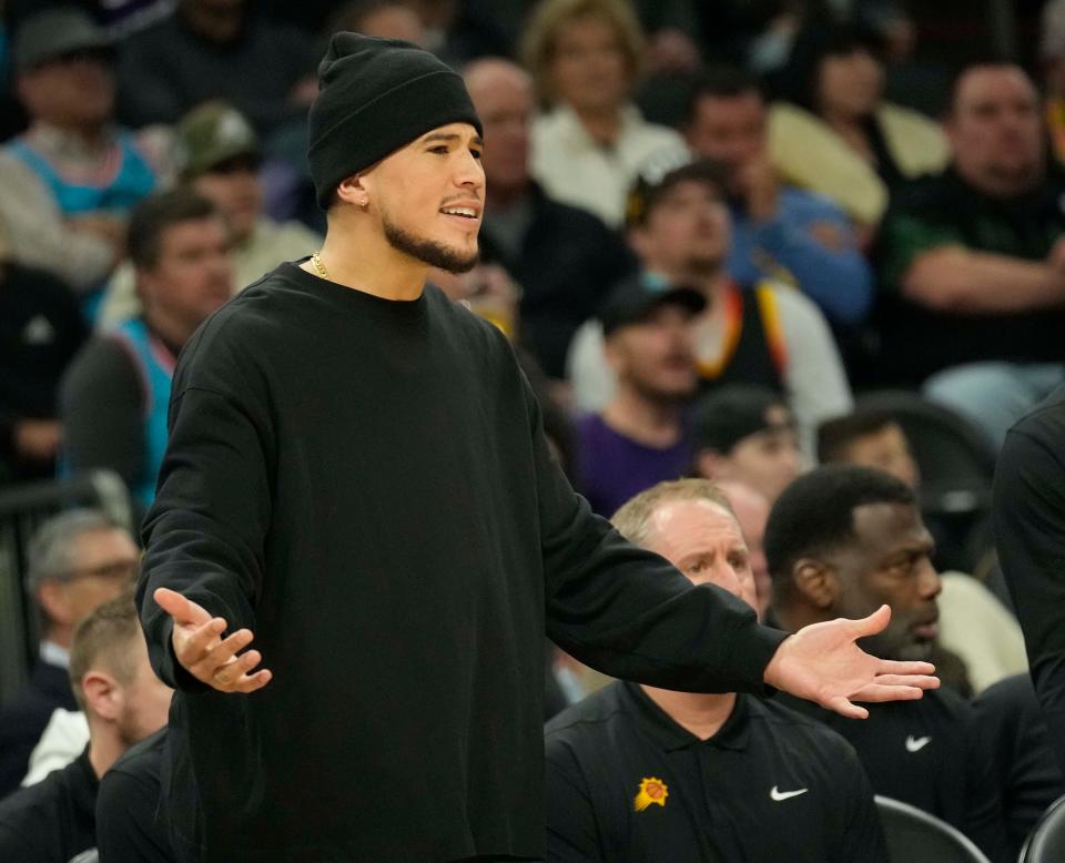 Phoenix Suns guard Devin Booker reacts to a play against the Toronto Raptors during the first quarter at Footprint Center in Phoenix on Jan. 30, 2023.