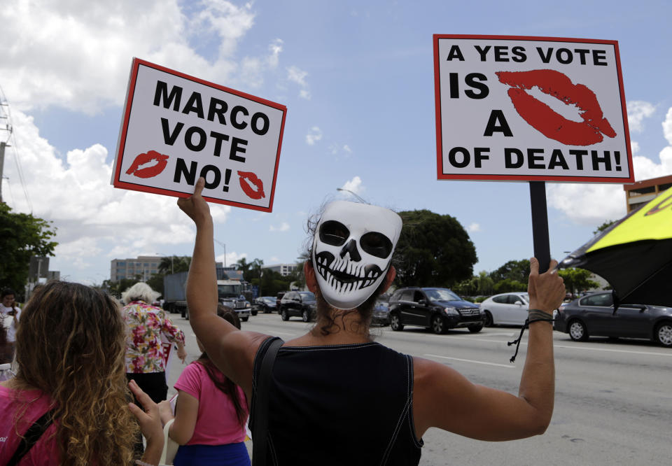 <p>Alessandra Mendolfi protests agains the current GOP health care bill outside of the office of Sen. Marco Rubio, Wednesday, June 28, 2017, in Miami, Fla. (Photo: Lynne Sladky/AP) </p>