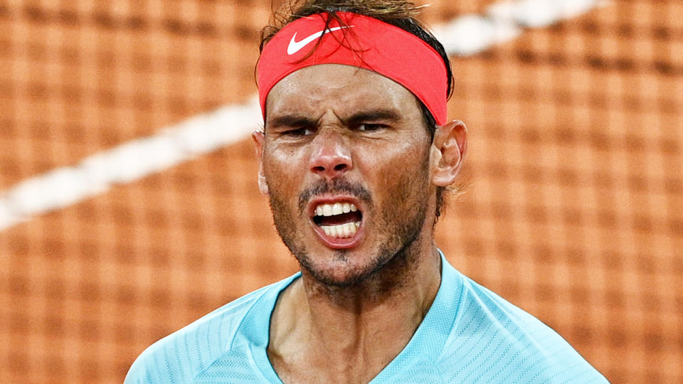 Rafael Nadal is pictured celebrating a point won against Italy's Jannik Sinner.