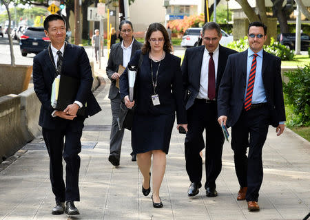 Hawaii Attorney General Douglas Chin (L) arrives at the U.S. District Court Ninth Circuit to present his arguments after filing an amended lawsuit against President Donald Trump's new travel ban in Honolulu, Hawaii, March 15, 2017. REUTERS/Hugh Gentry