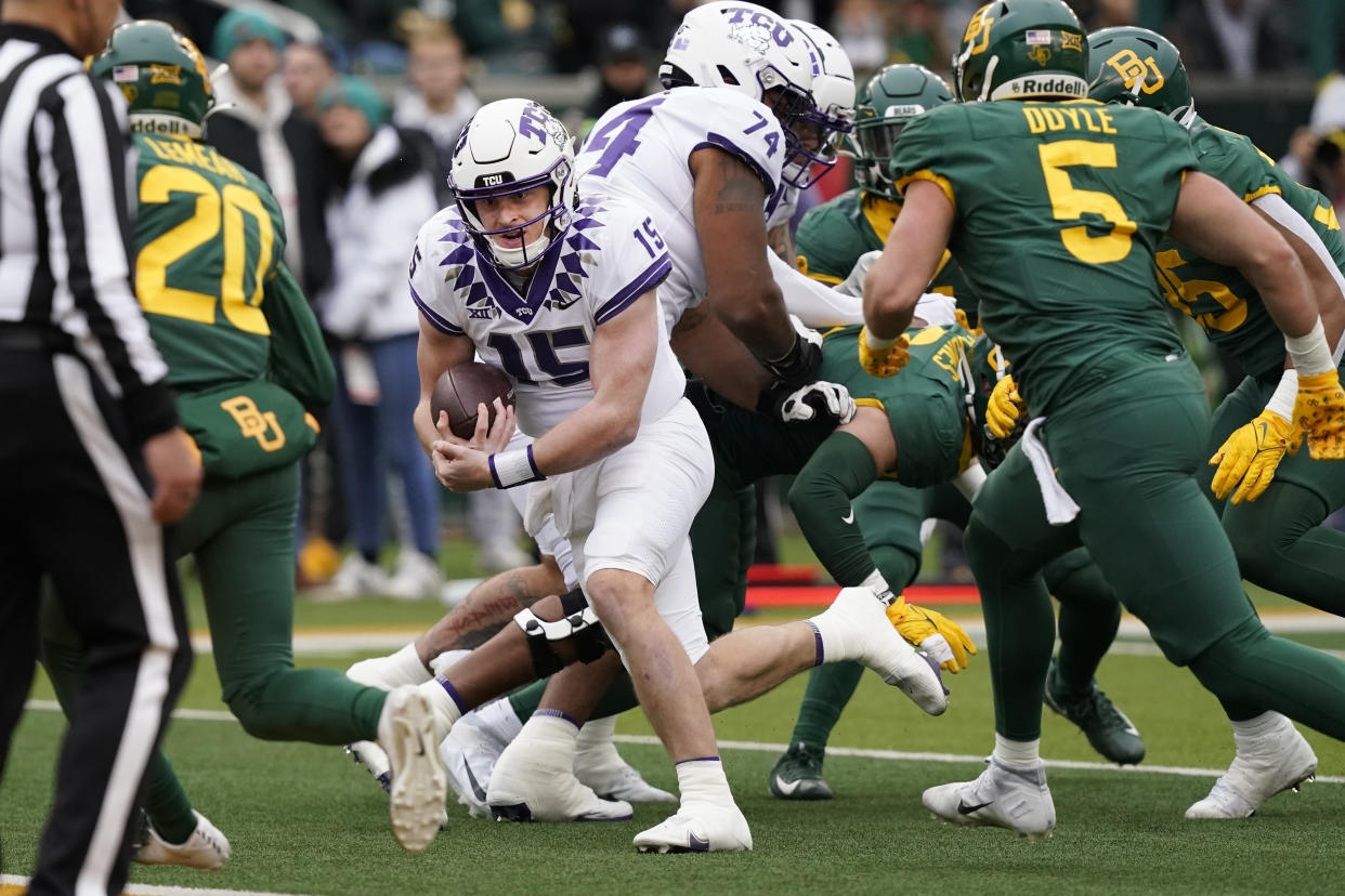 TCU quarterback Max Duggan (15) has been a critical part of his team's magical undefeated season. He has a chance to lead TCU to the College Football Playoff. (AP Photo/LM Otero)