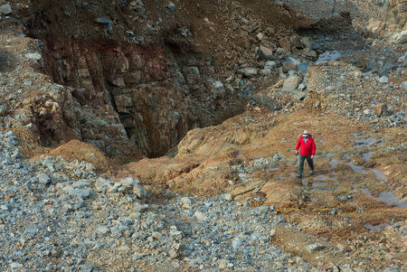 California Department of Water Resources crews inspect and evaluate the erosion just below the Lake Oroville Emergency Spillway site after lake levels receded, in Oroville, California, U.S., February 13, 2017. Kelly M. Grow/ California Department of Water Resources/Handout via REUTERS