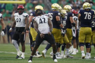 Cincinnati's Malik Vann (42) reacts after sacking Notre Dame quarterback Drew Pyne (10) during the second half of an NCAA college football game, Saturday, Oct. 2, 2021, in South Bend, Ind. Cincinnati won 24-13. (AP Photo/Darron Cummings)