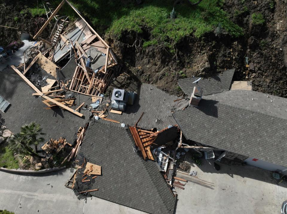 An aerial view shows a property damaged by a landslide, Wednesday, March 13, 2024, in the Sherman Oaks section of Los Angeles.