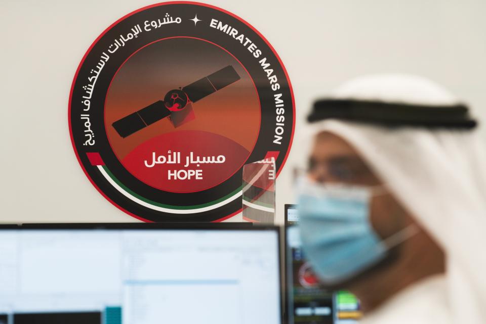 An Emirati scientist prepares for the launch of the Emirates' Hope space probe to Mars at the Mohammed bin Rashid Space Centre in Dubai, United Arab Emirates, Sunday, July 19, 2020. A Japanese H-IIA rocket carrying a United Arab Emirates Mars spacecraft has been placed on the launch pad for Monday's scheduled liftoff for the Arab world's first interplanetary mission, officials said Sunday. (AP Photo/Jon Gambrell)