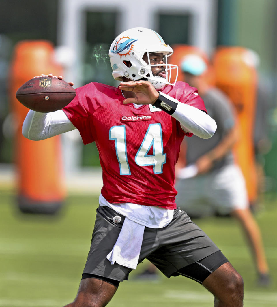 Miami Dolphins quarterback Jacoby Brissett (14) throws during NFL football practice, Wednesday, Sept. 22, 2021 in Miami Gardens, Fla. (David Santiago/Miami Herald via AP)