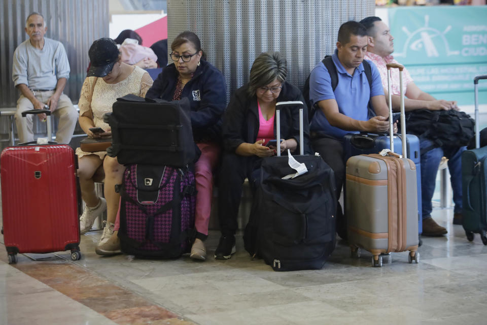 A group of passengers is waiting to board inside Mexico City's International Airport, on July 5, 2024, as there are some flight delays due to Hurricane Beryl. (Photo by Gerardo Vieyra/NurPhoto via Getty Images)