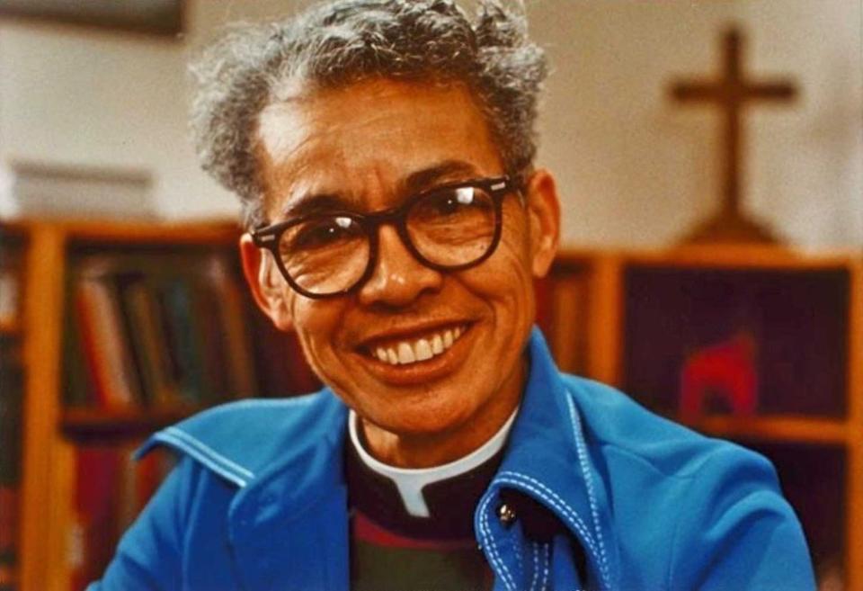 Pauli Murray seated in her study. 