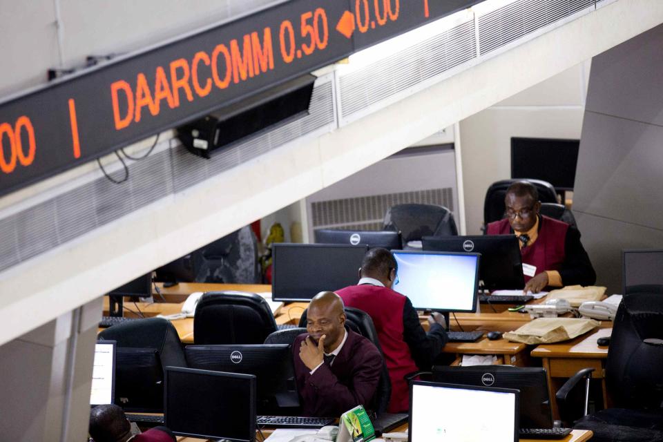 Traders work at the Nigerian Stock Exchange in Lagos, February 13, 2015. REUTERS/Joe Penney