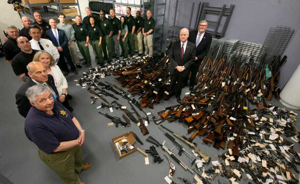 Law enforcement officials display firearms taken off the street during Morris County’s Gun Buyback program, held May 14 and 15, 2022.