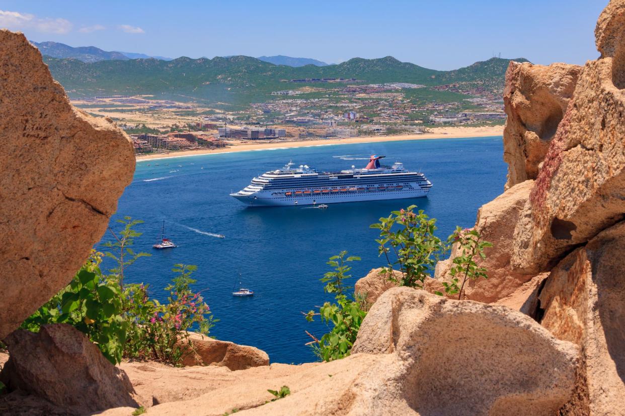 cruise ship in cabo san lucas seen from rock formation