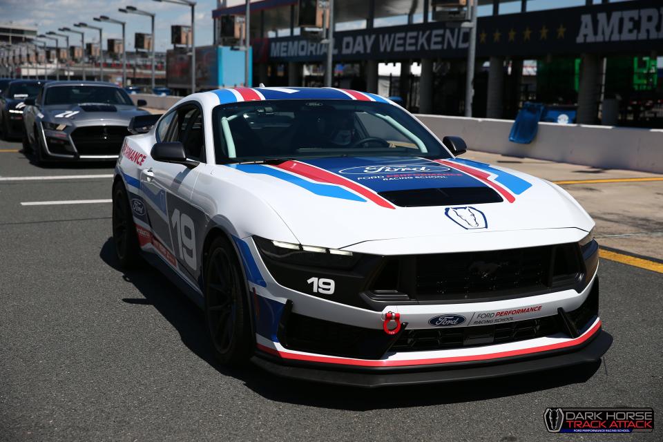 Joseph Tegerdine, 18, of Springville, Utah, is seen here at the Ford Performance Center track in Charlotte, North Carolina, in April 2024. He is preparing to drive a 2024 Ford Mustang Dark Horse, an experience gifted by Ford CEO Jim Farley.