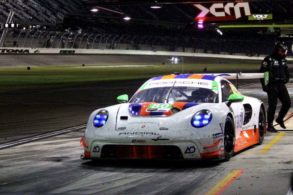 a porsche 911 gtd car in the pit lane