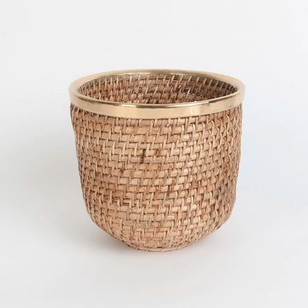 The brass-detailed <a href="https://fave.co/2S8ulyG" rel="noopener" target="_blank" data-ylk="slk:Aardik cane planter by Fabindia;elm:context_link;itc:0;sec:content-canvas" class="link ">Aardik cane planter by Fabindia</a>. Diameter: 8.5 inches. <em>Rs.1,690.</em> <a href="https://fave.co/2S8ulyG" rel="noopener" target="_blank" data-ylk="slk:Buy here!;elm:context_link;itc:0;sec:content-canvas" class="link "><strong>Buy here!</strong></a>