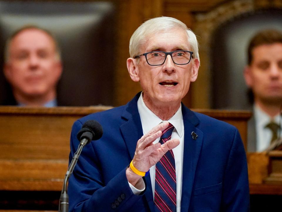 Wisconsin Gov. Tony Evers speaks at a pulpit.