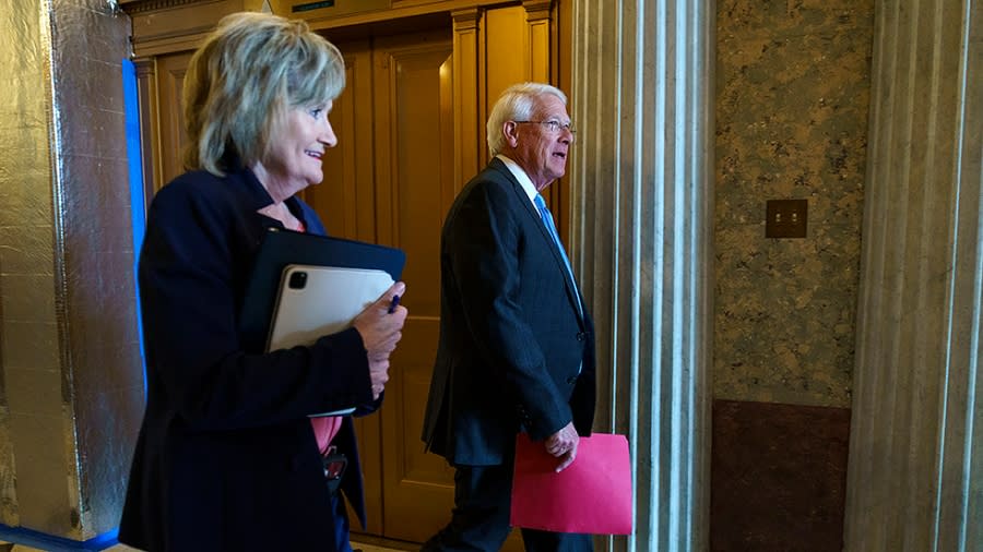 Sens. Cindy Hyde-Smith (R-Miss.) and Roger Wicker (R-Miss.) leave the Senate Chamber following a procedural nomination vote on Tuesday, May 3, 2022.