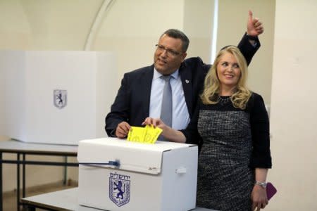 FILE PHOTO: Jerusalem mayoral candidate Moshe Lion and his wife cast their votes in the second round of local council elections in Jerusalem November 13, 2018. REUTERS/Ammar Awad