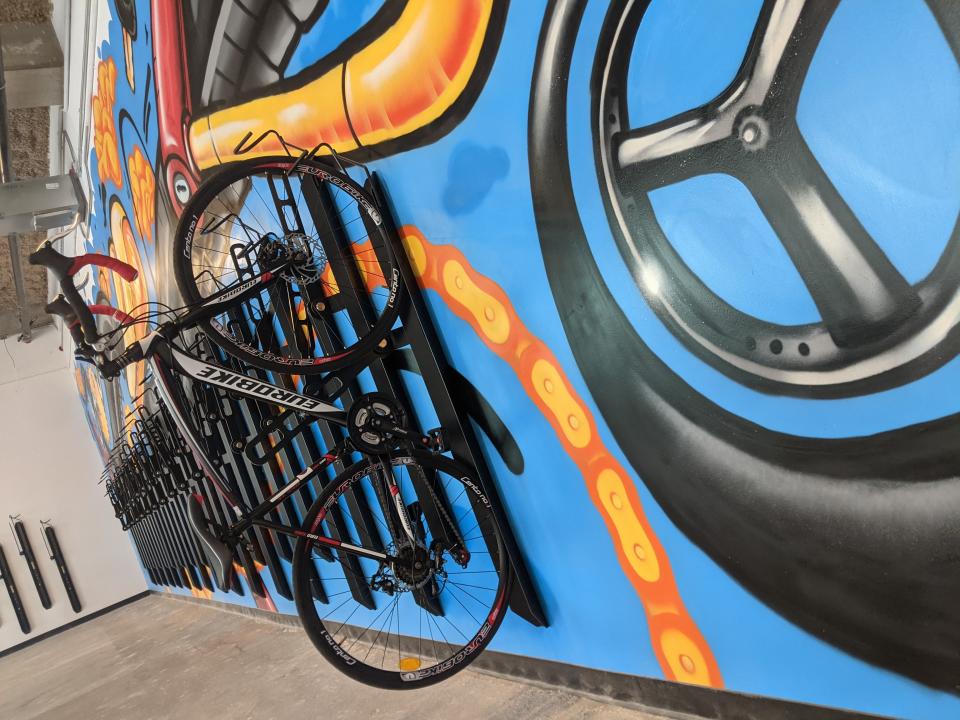 A mural sits inside the bike hub on the first floor of the Downtown Mobility Center in Downtown Memphis. Guests can securely store their bicycles in the hub daily or overnight.