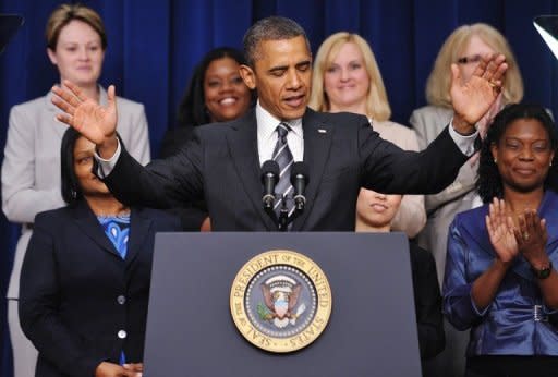 US President Barack Obama asks audience members to take their seats before speaking at the White House Forum on Women and the Economy April 6, in Washington, DC. Democrats have piled pressure on Republicans by accusing them of neglecting women's rights by favoring conservative policies on abortion, contraception and other social concerns