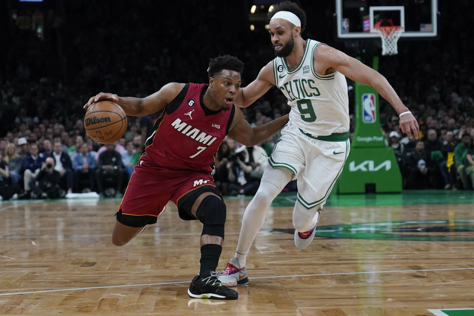 Miami Heat guard Kyle Lowry (7) drives to the basket against Boston Celtics guard Derrick White (9) in the first half of Game 1 of the NBA basketball Eastern Conference finals playoff series in Boston, Wednesday, May 17, 2023. (AP Photo/Charles Krupa)